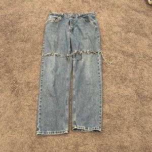 Blue wrangler safety pin jeans.